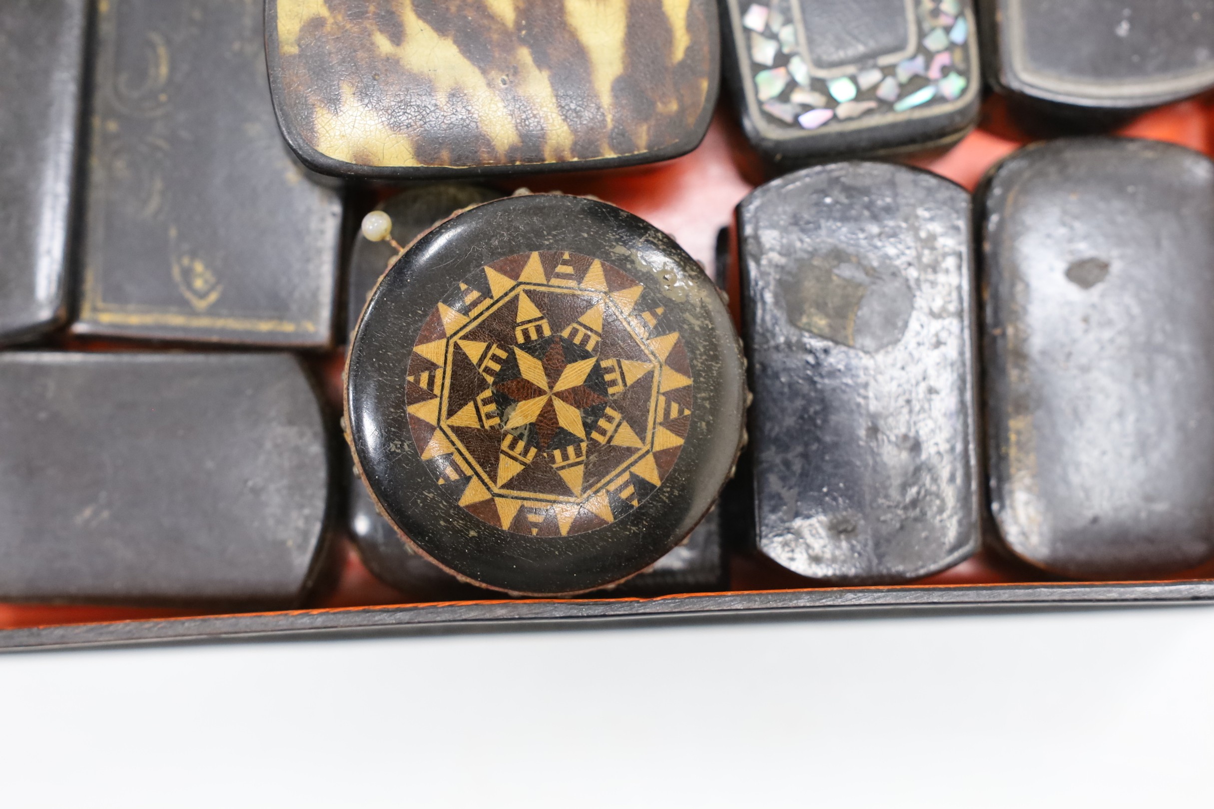 A collection of Victorian papier mache snuff boxes and a Tunbridge ware pin wheel